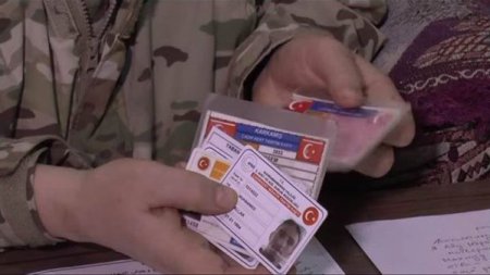 Бойцы Хезболлы и САА показывают личные документы террористов, убитых под Алеппо