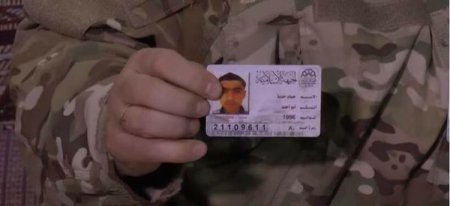 Бойцы Хезболлы и САА показывают личные документы террористов, убитых под Алеппо